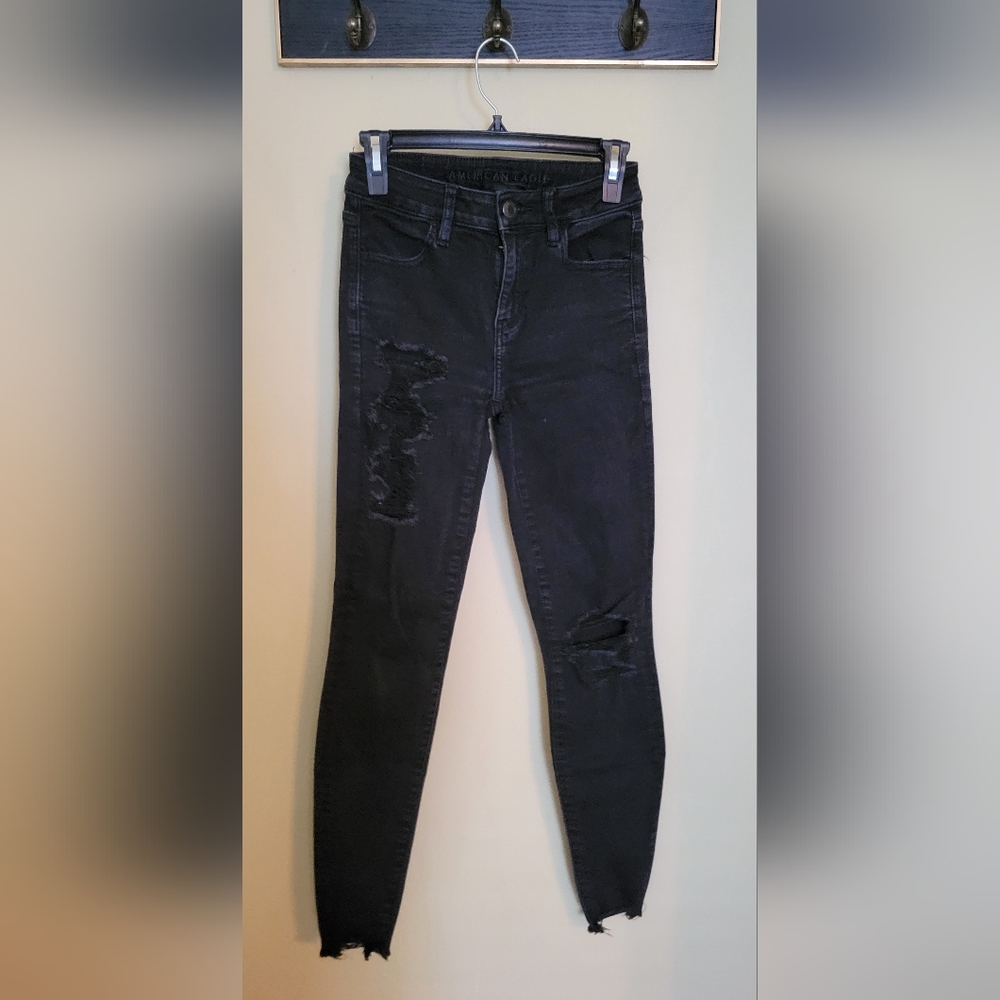 Distressed black jeggings